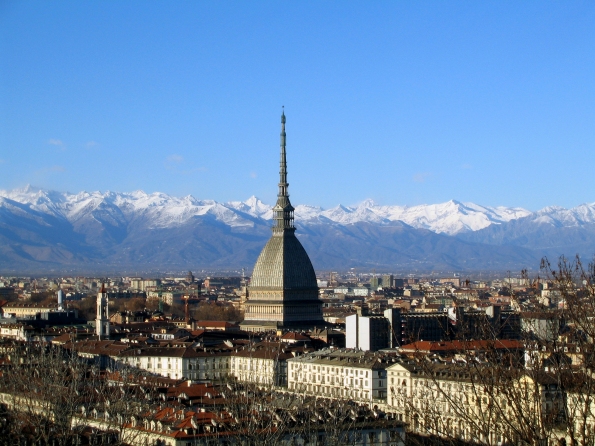 Panorama of Turin: piazzas and historic buildings lie against the backdrop of the Alps.